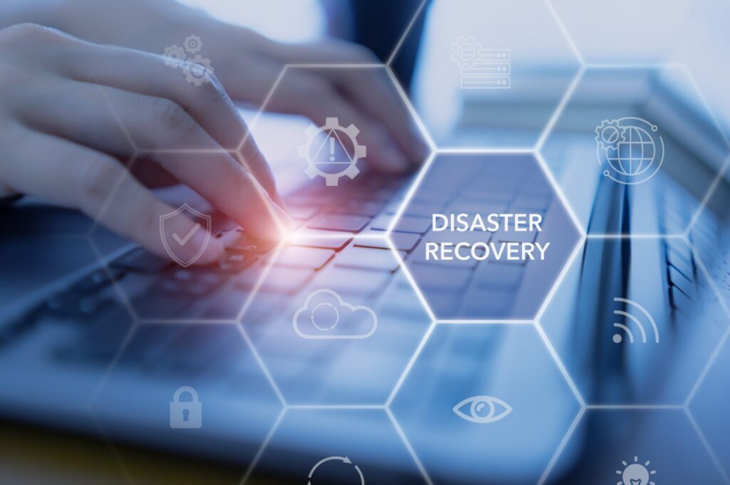 Graphic showing disaster recovery overlay with hands and keyboard